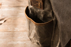 The water bottle pocket of canvas messenger bag for men 